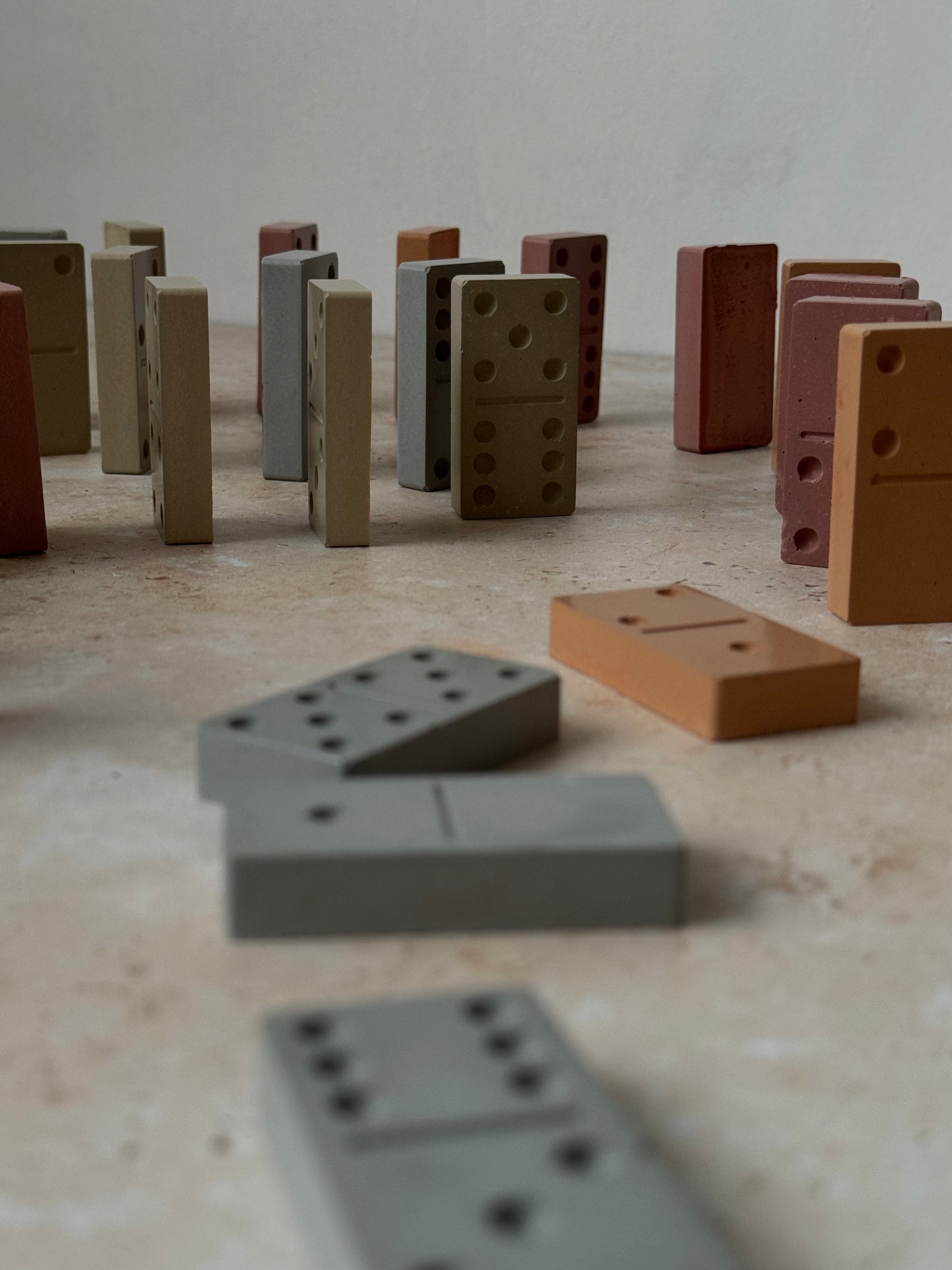 multi color concrete dominoes, colorful dominoes, colorful set of dominoes, concrete dominoes