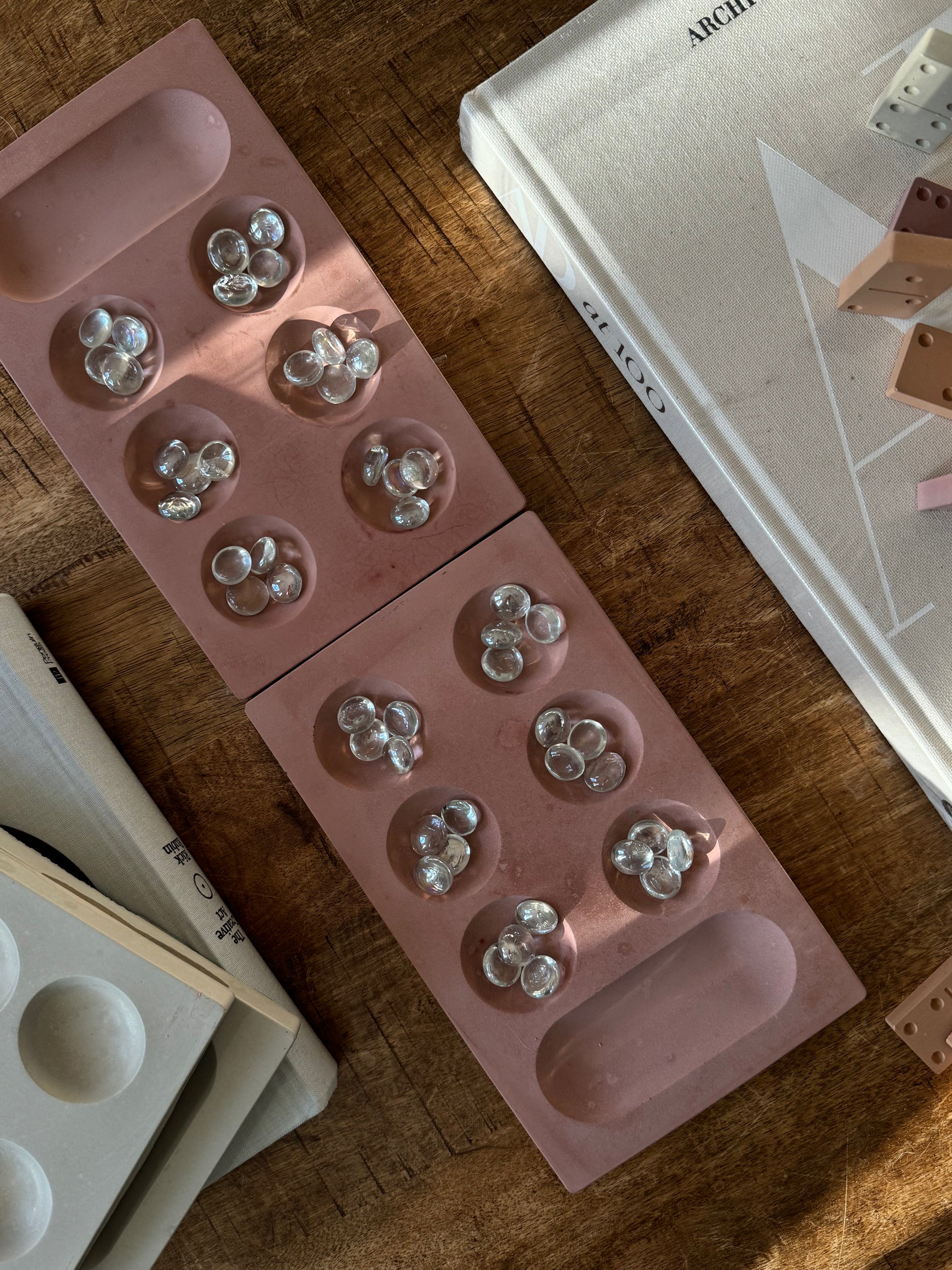 concrete mancala, aesthetic table game, aesthetic mancala, trendy coffee table decor, coffee table style, trendy table game, trendy game decor