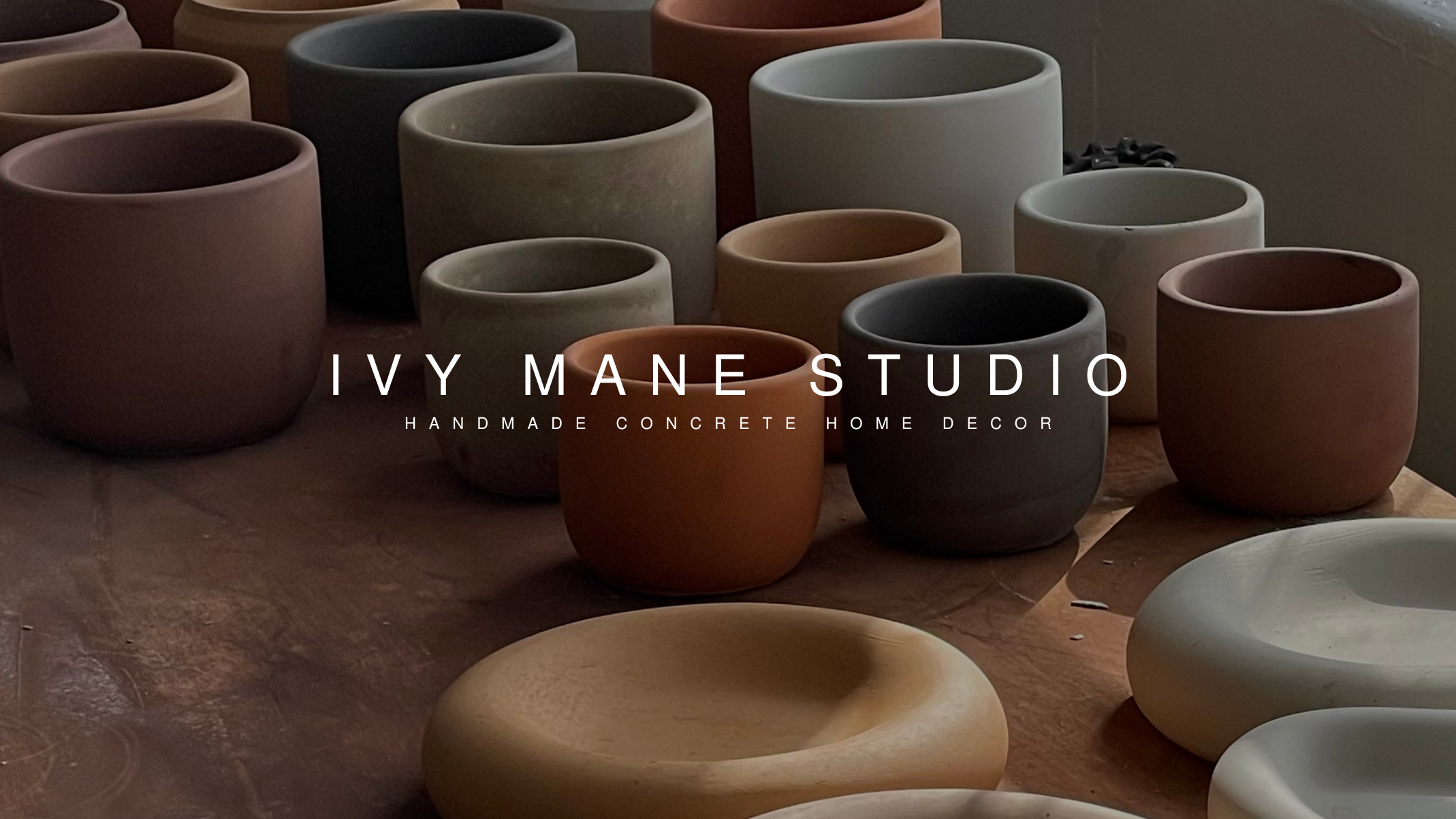 handmade concrete home decor. minimalist concrete plant pots, concrete pots, trays, and dishes in a variety of colors, shapes, and sizes.